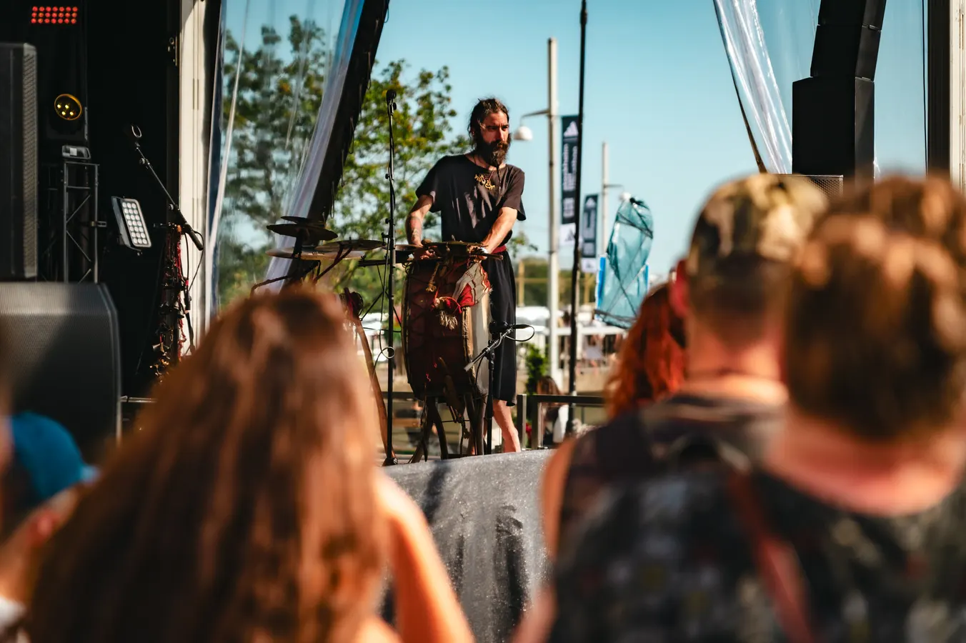Drummer playing at an outdoor festival