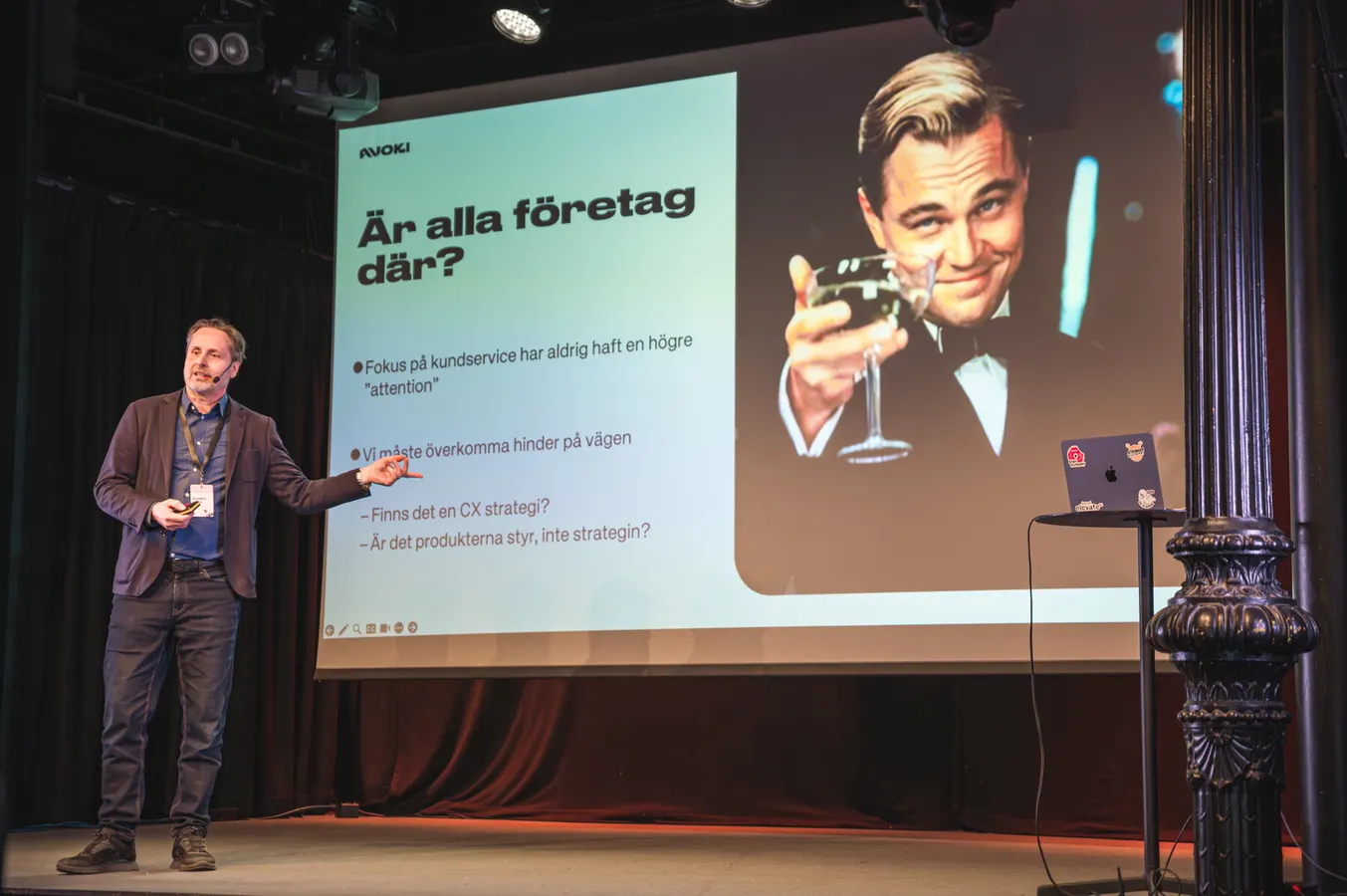 Presentation slide on a large conference screen
