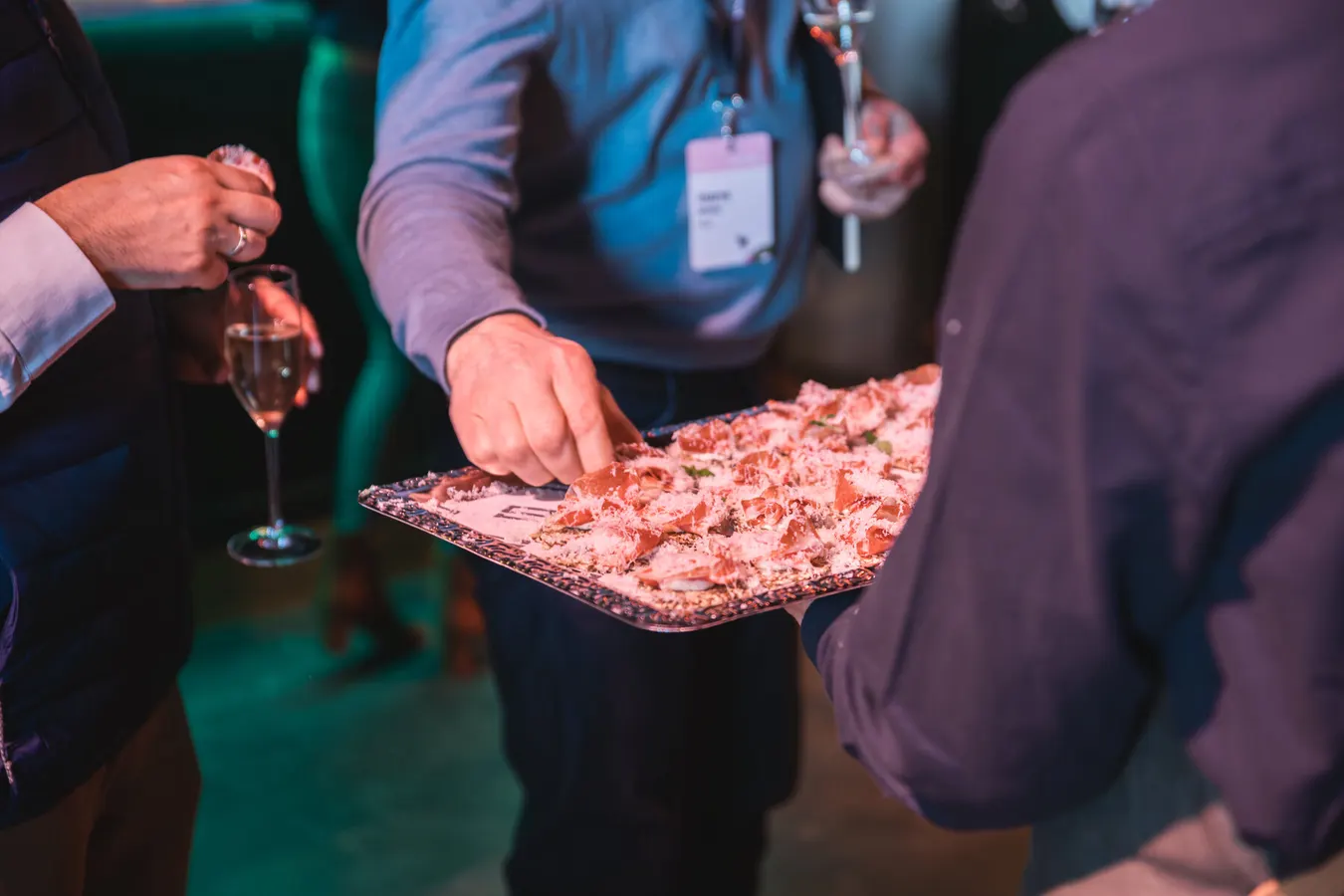 Guest taking a canapé from a serving tray