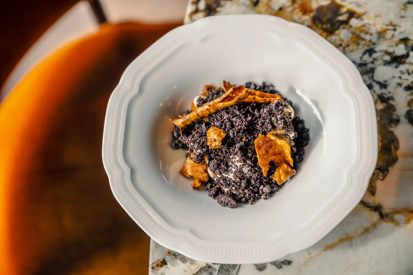 Chocolate crumble dessert on a white plate