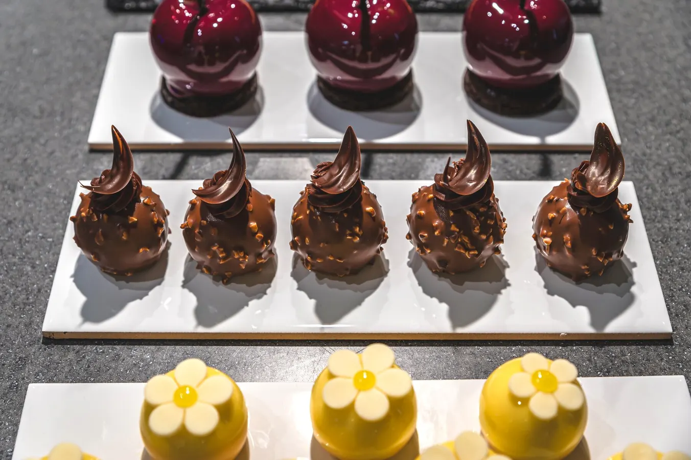 Chocolate and cherry petits fours in a display